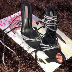 Black heeled sandals with faux crystal laces